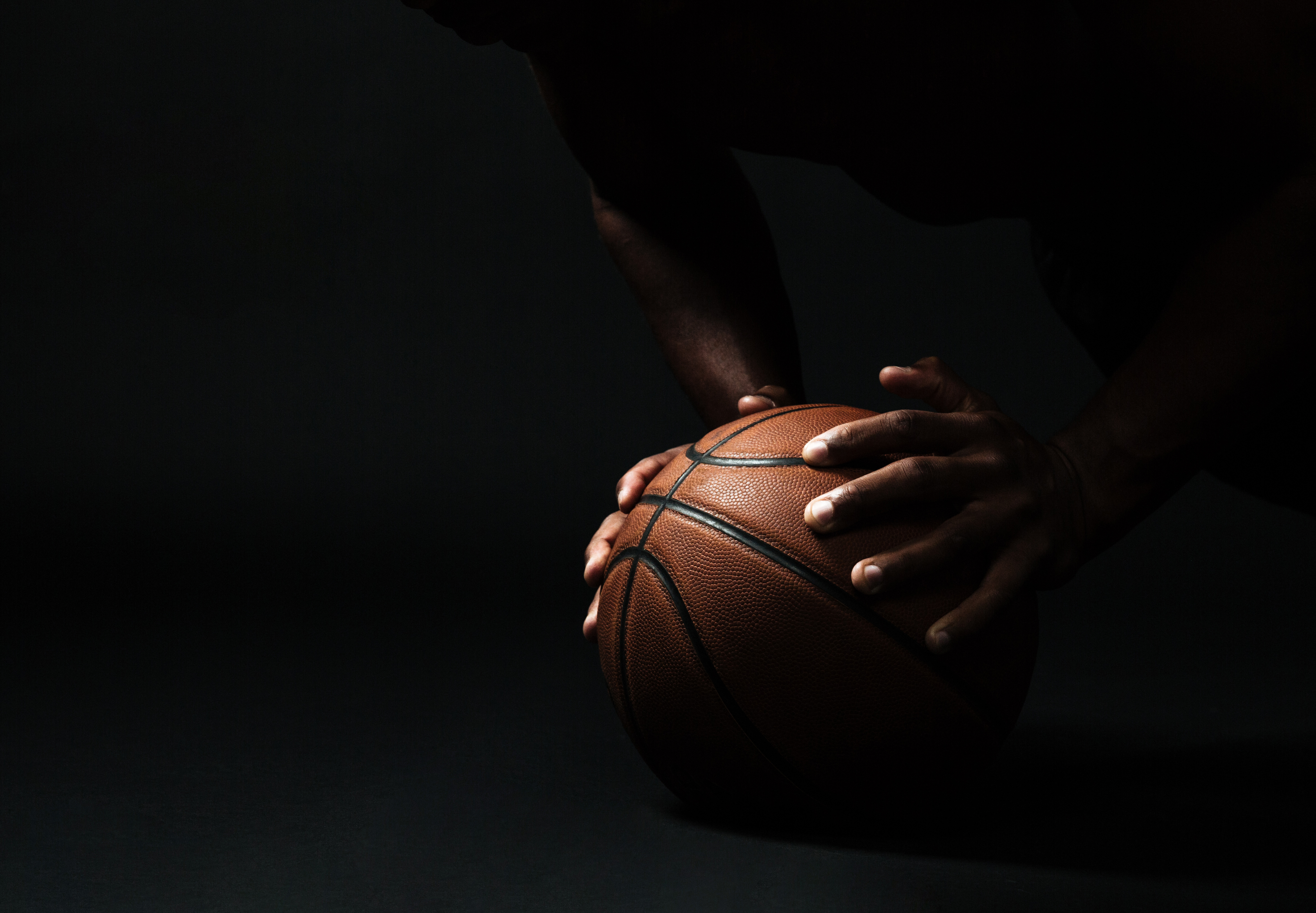 Basketball players in action during a fantasy sports game